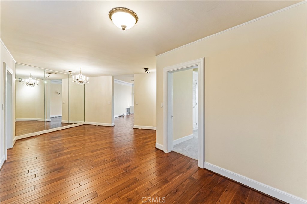 770 Hillcrest Drive, Unit 7 Laguna Beach, CA 92651 - Photo 5 of 30 a view of an empty room with wooden floor