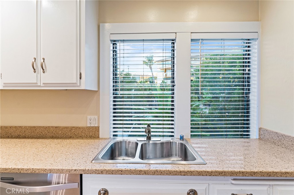 770 Hillcrest Drive, Unit 7 Laguna Beach, CA 92651 - Photo 9 of 30 a kitchen with a sink and a window