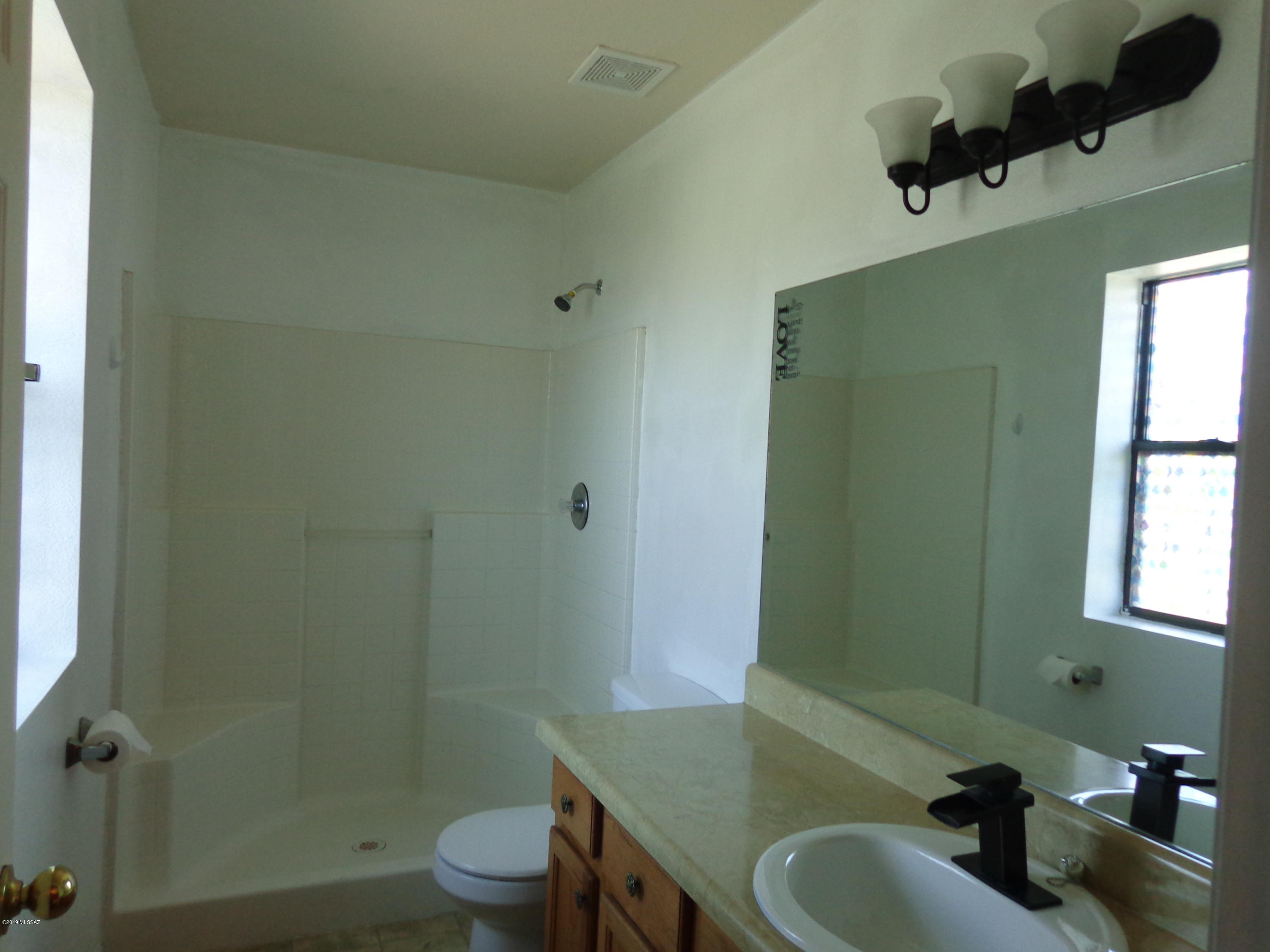 1223 Yave Court Rio Rico, AZ 85648 - Photo 13 of 15 a bathroom with a sink and a mirror