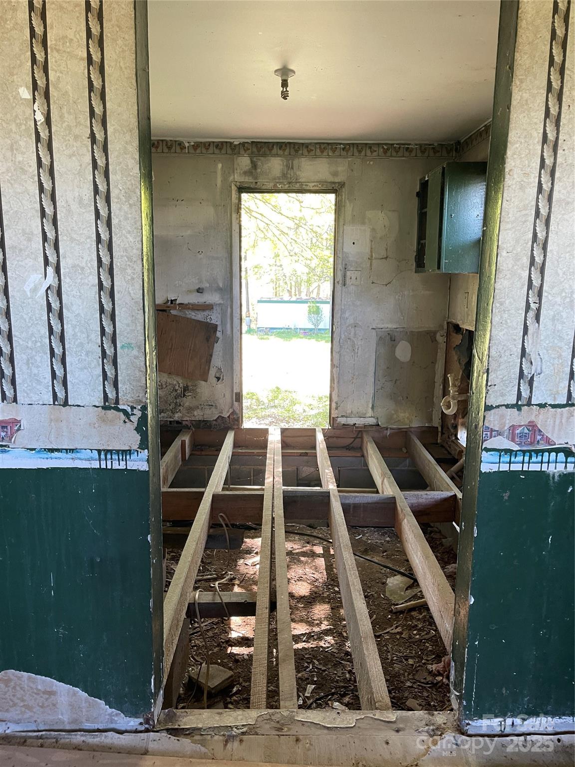5735 Fallston Road Lawndale, NC 28090 - Photo 16 of 17 a view of kitchen with wooden floor and a fireplace