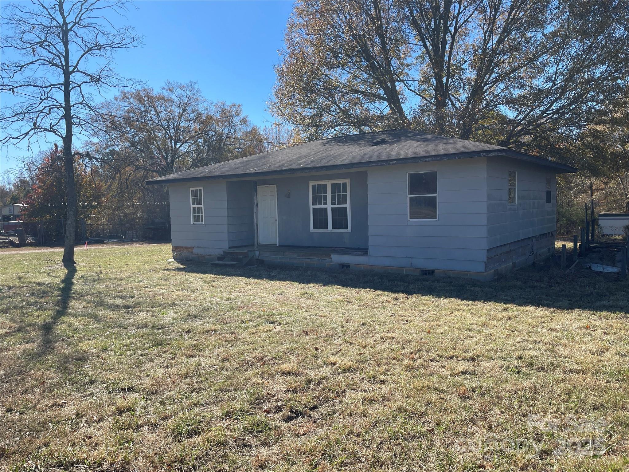 5735 Fallston Road Lawndale, NC 28090 - Photo 4 of 17 a backyard of a house with large trees