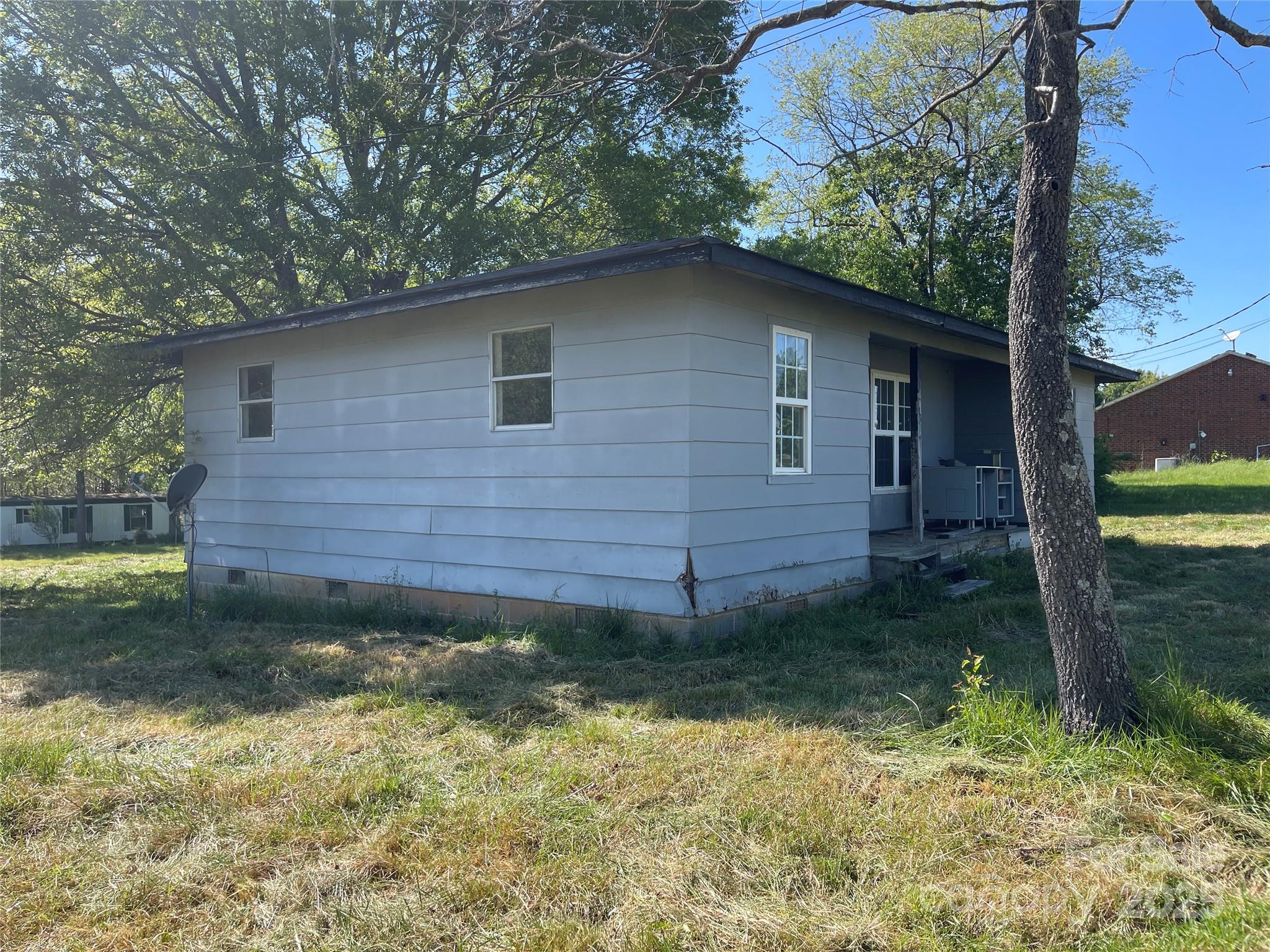 5735 Fallston Road Lawndale, NC 28090 - Photo 5 of 17 a backyard of a house with lots of green space