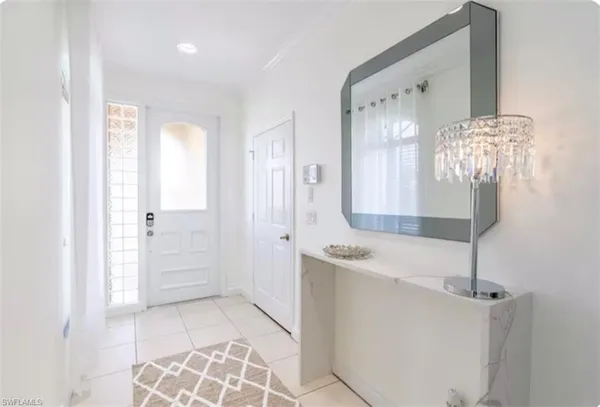 a bathroom with a granite countertop sink a mirror and a shower
