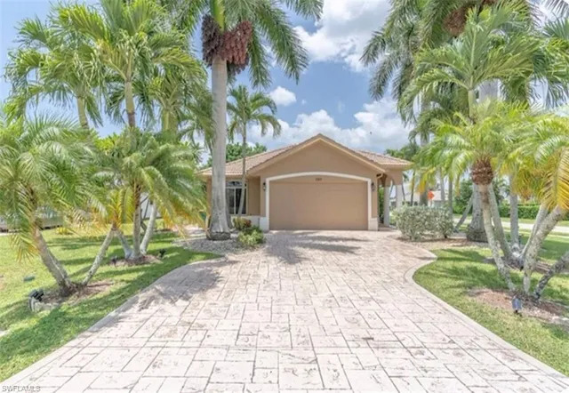 a front view of house with yard and green space