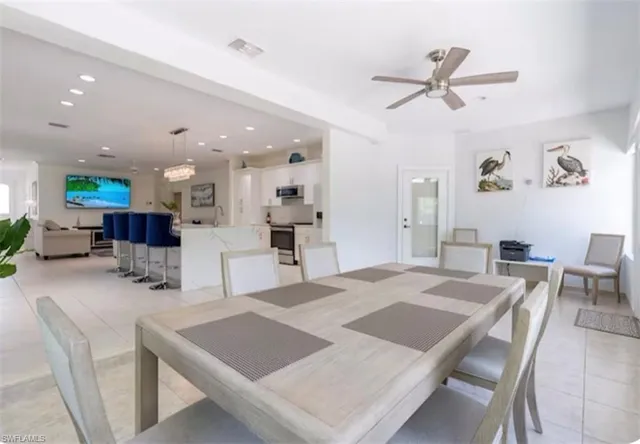 a front view of a house with a yard and a garage