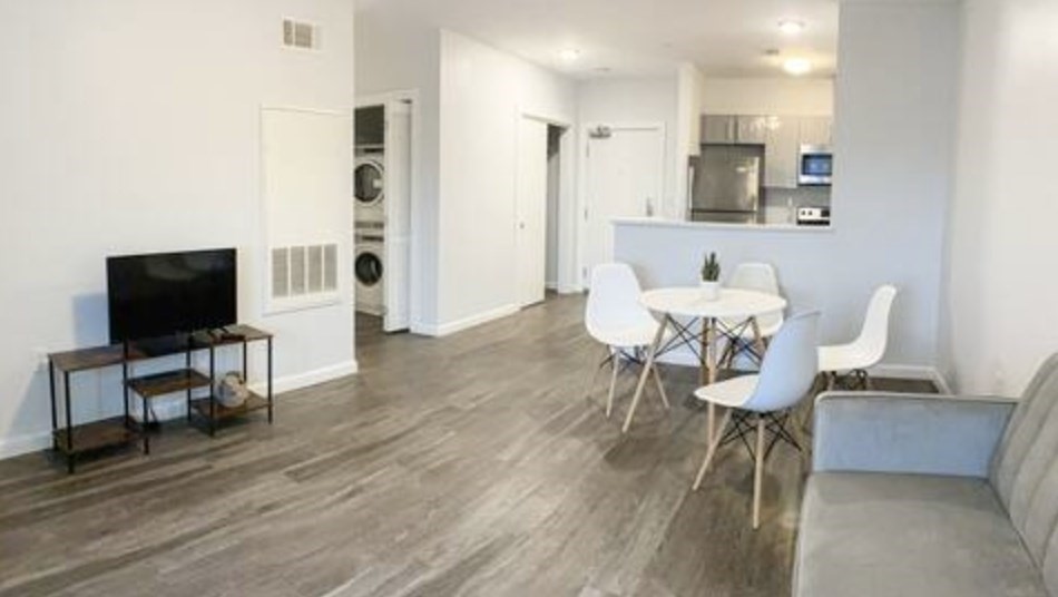 1505 Commonwealth Avenue, Unit 403 Boston, MA 02135 - Photo 1 of 16 a view of a dining room with furniture and wooden floor
