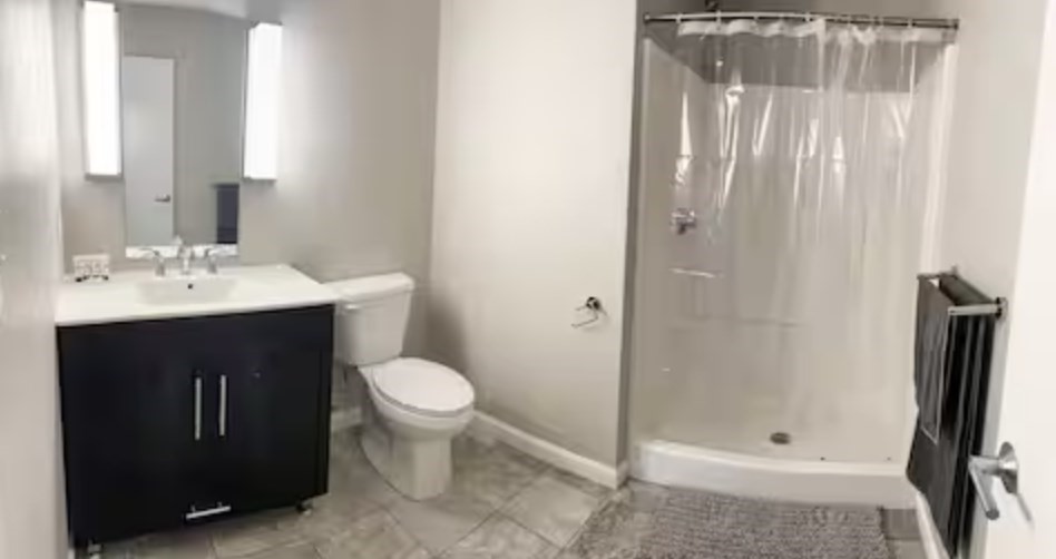1505 Commonwealth Avenue, Unit 403 Boston, MA 02135 - Photo 14 of 16 a bathroom with a sink toilet and shower
