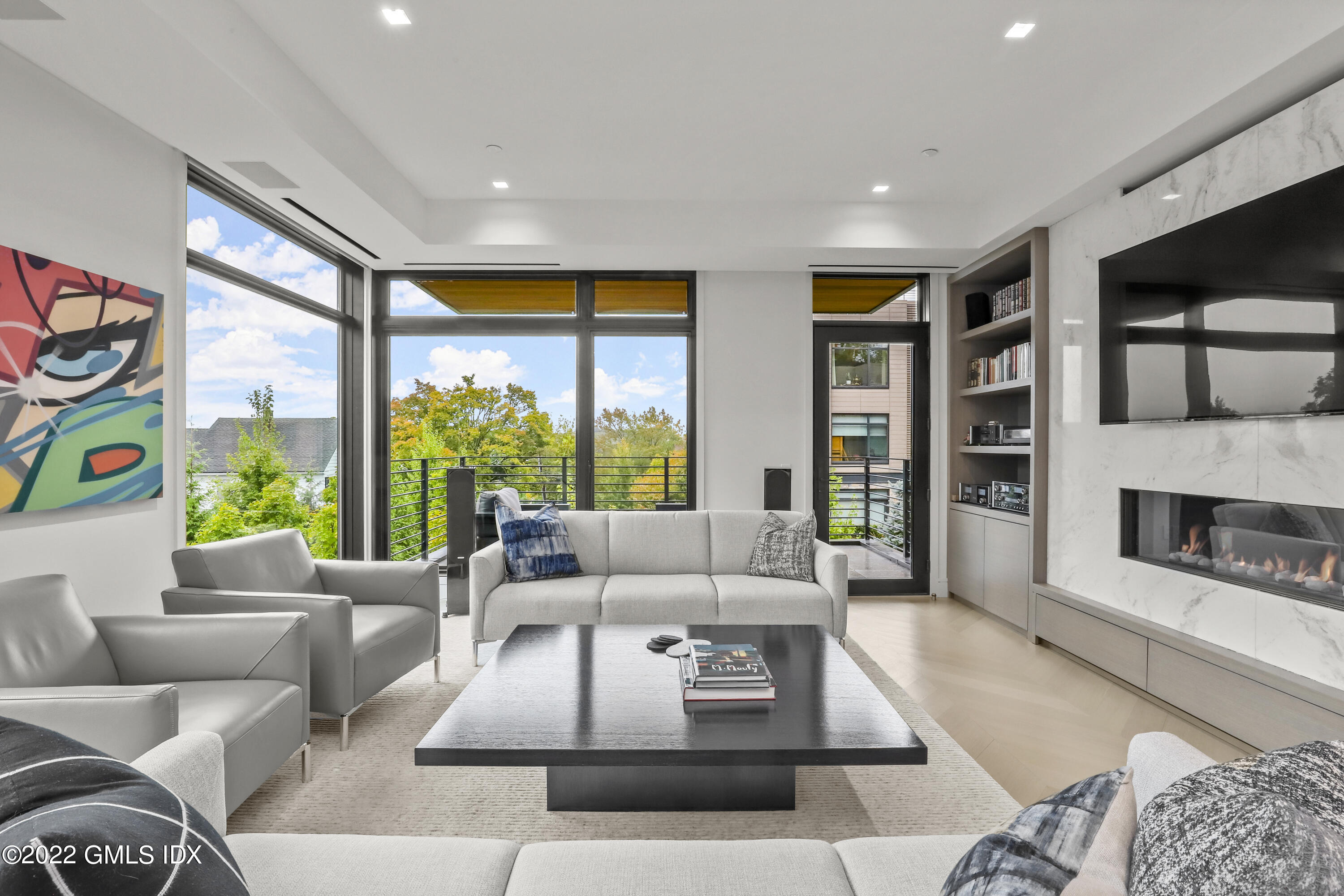 125 Field Point Road, Unit A4 Greenwich, CT 06830 - Photo 1 of 33 a living room with furniture and a large window