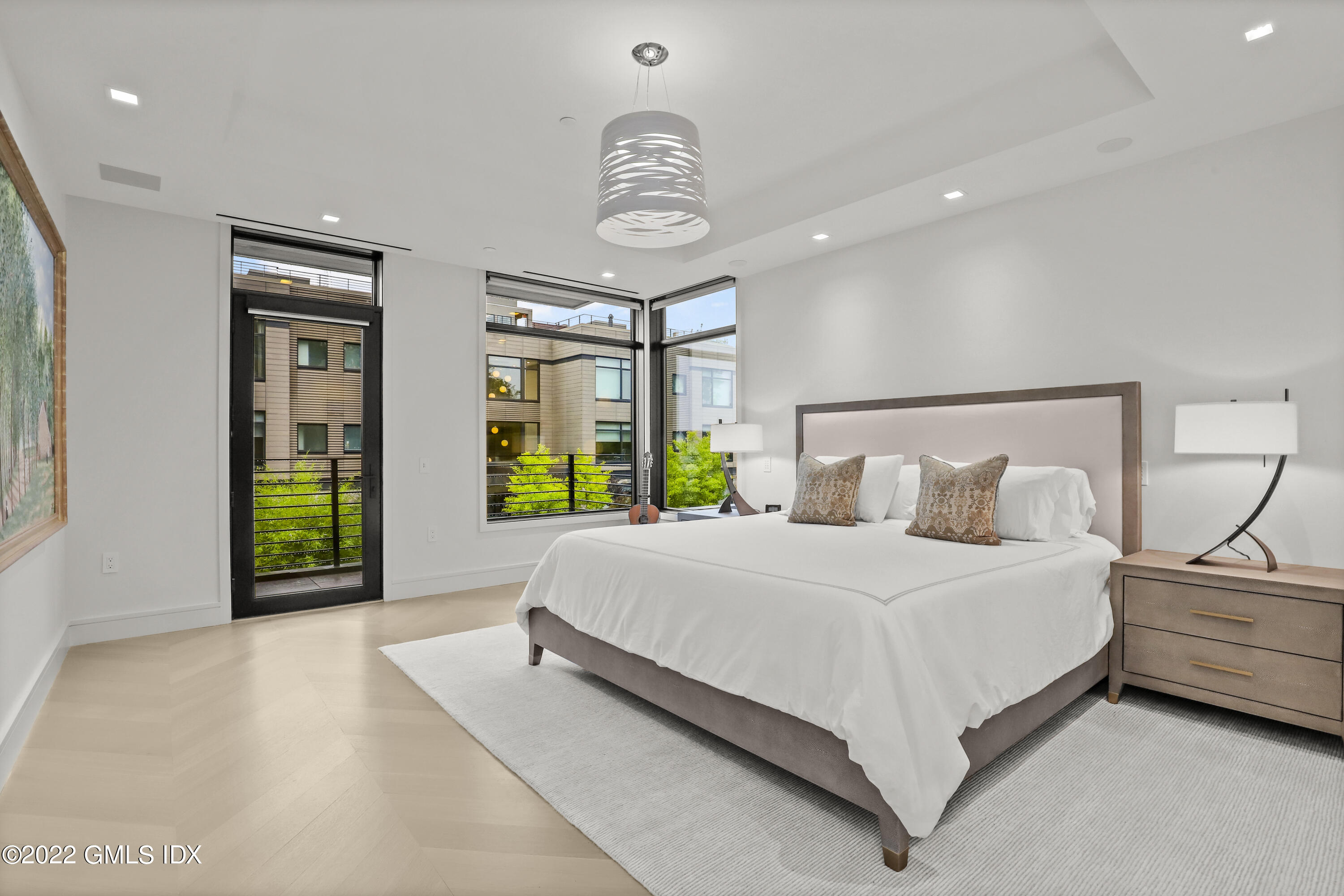 125 Field Point Road, Unit A4 Greenwich, CT 06830 - Photo 12 of 33 a bedroom with a bed and a large window