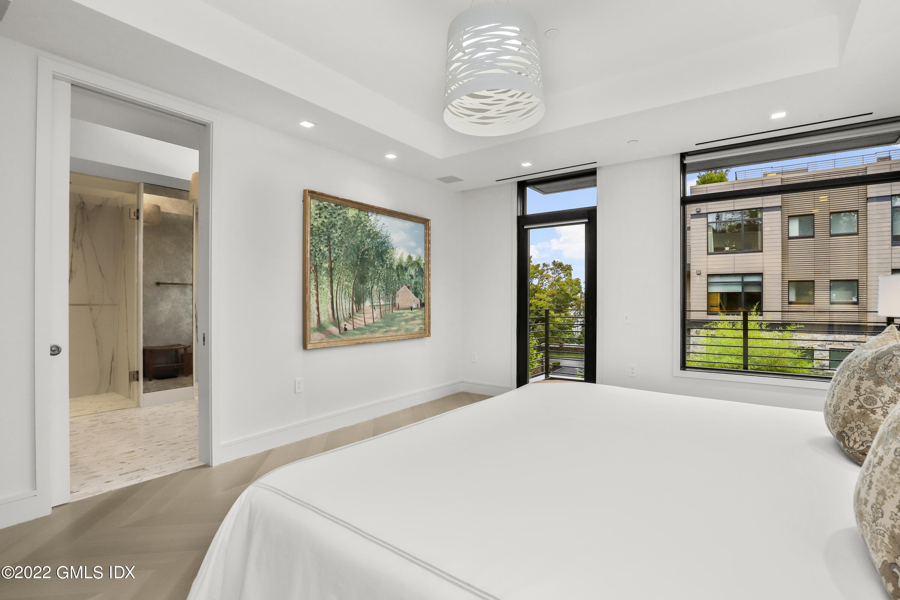 125 Field Point Road, Unit A4 Greenwich, CT 06830 - Photo 14 of 33 a bedroom with a bed and a window