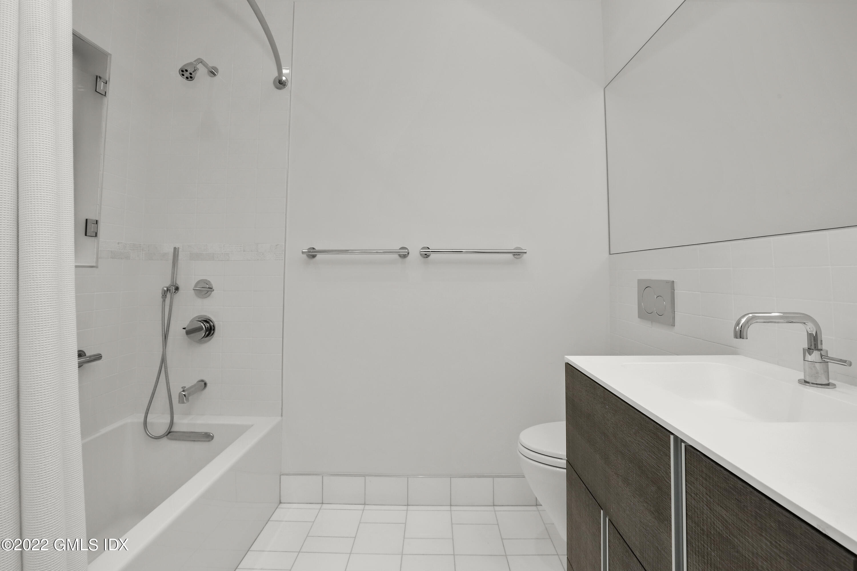 125 Field Point Road, Unit A4 Greenwich, CT 06830 - Photo 19 of 33 a bathroom with a sink a toilet and shower