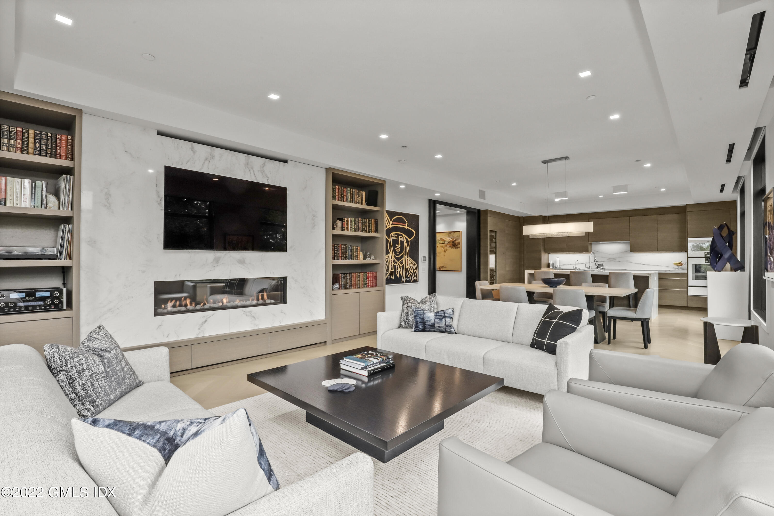125 Field Point Road, Unit A4 Greenwich, CT 06830 - Photo 3 of 33 a living room with furniture and a flat screen tv