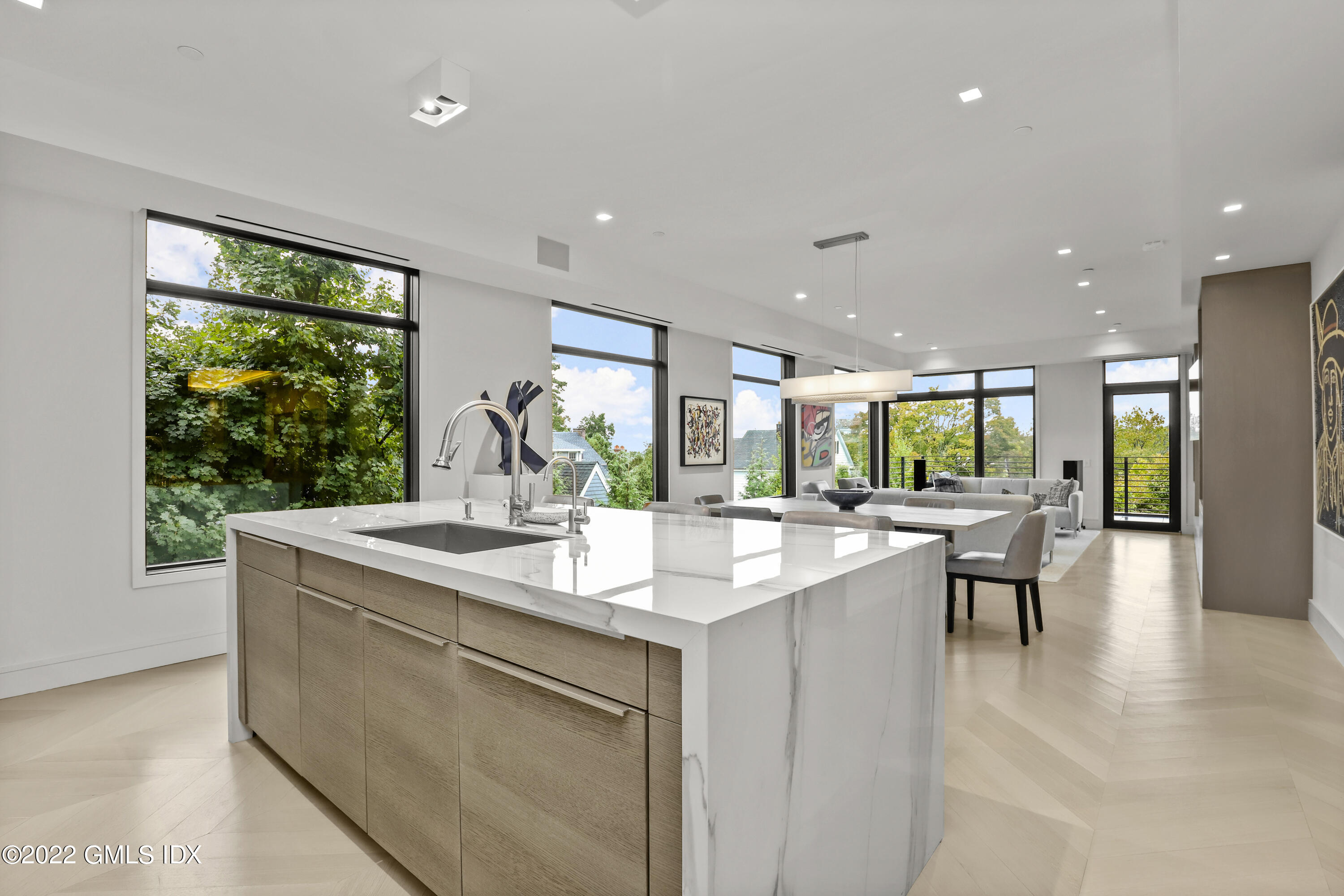 125 Field Point Road, Unit A4 Greenwich, CT 06830 - Photo 9 of 33 a dining hall with stainless steel appliances granite countertop furniture a large window and a sink