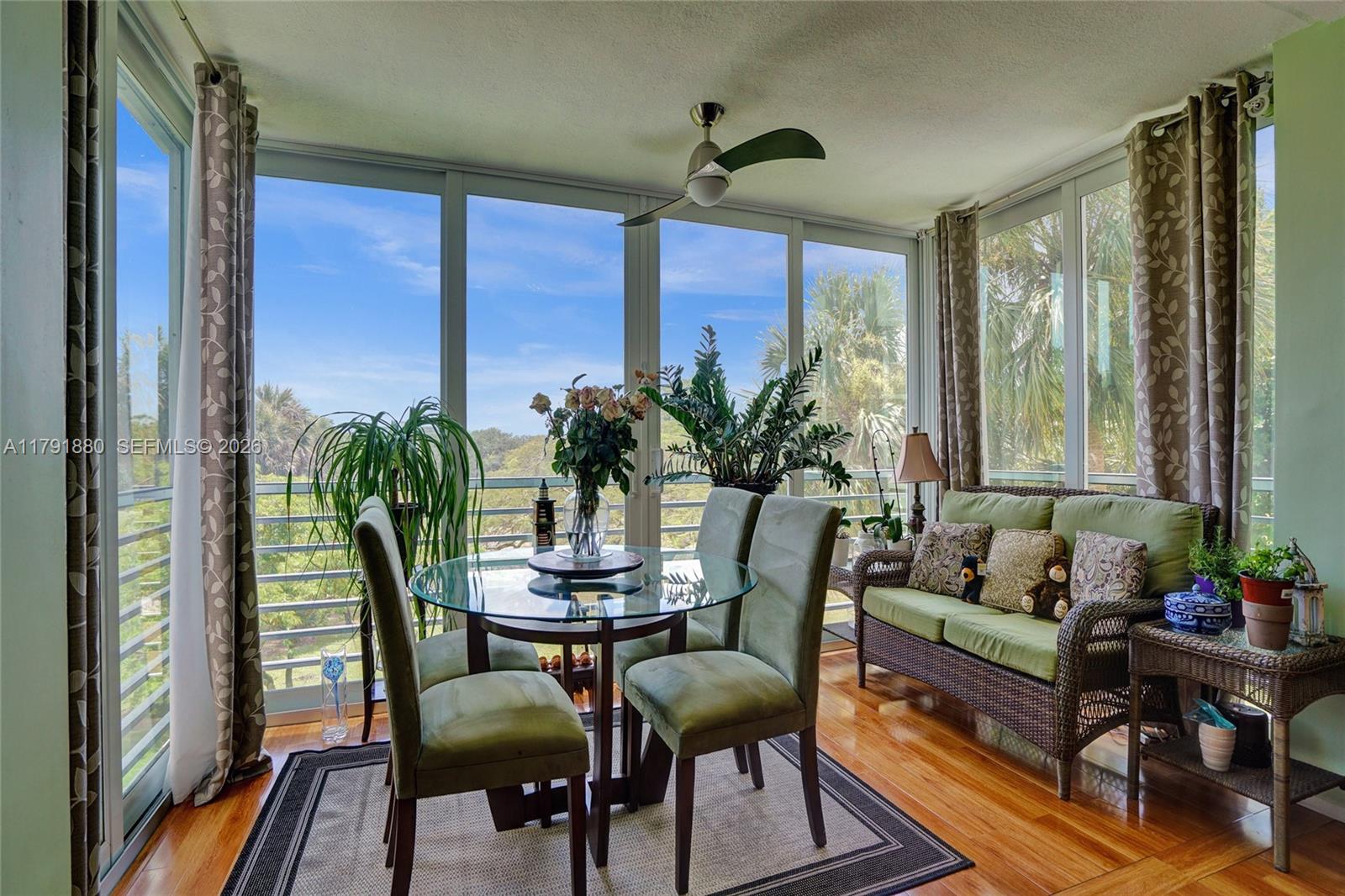 3520 Oaks Way, Unit 308 Pompano Beach, FL 33069 - Photo 11 of 40 a view of a dining room with furniture window and outside view