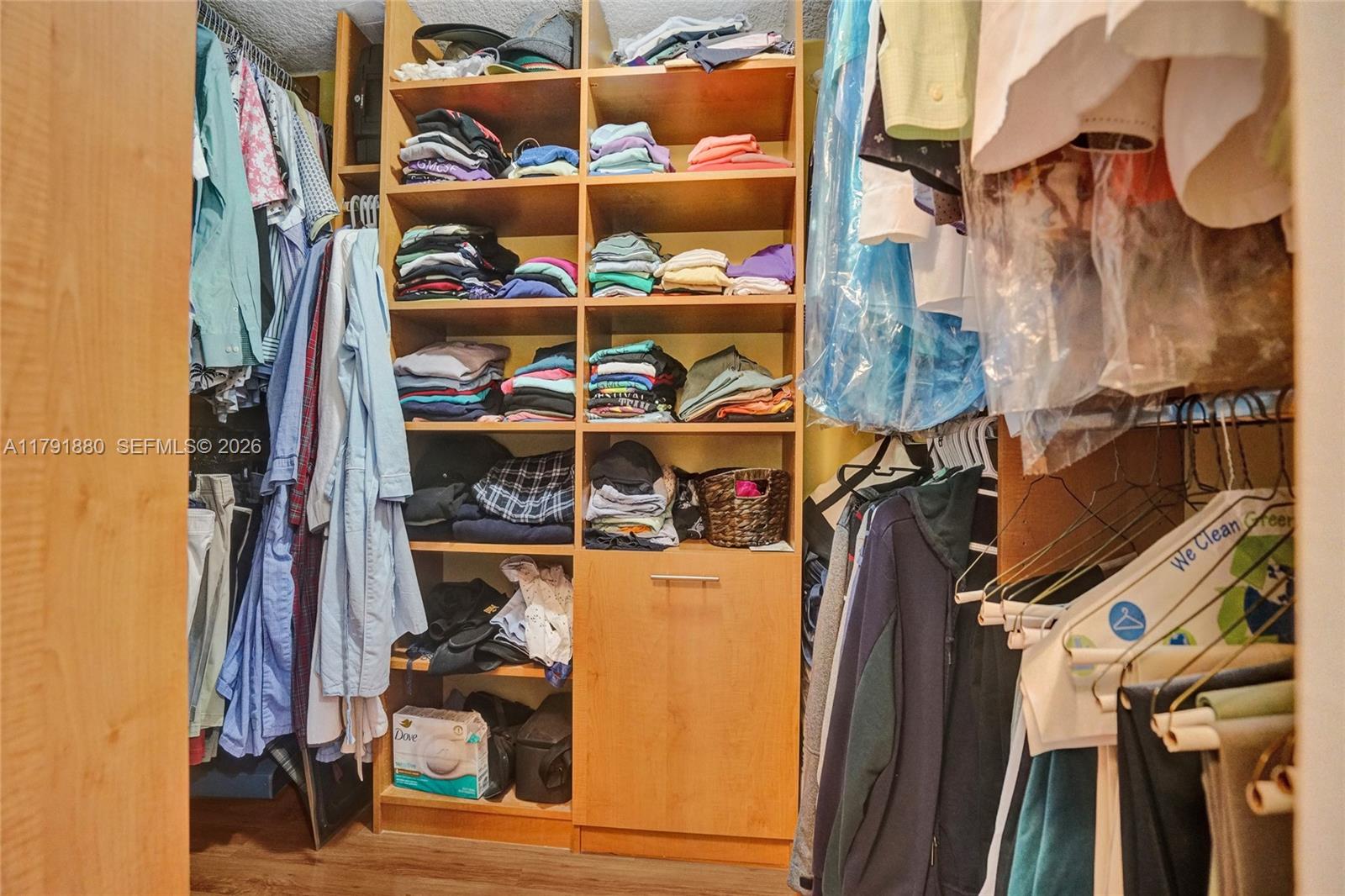 3520 Oaks Way, Unit 308 Pompano Beach, FL 33069 - Photo 21 of 40 a view of walk in closet with clothes and shoes