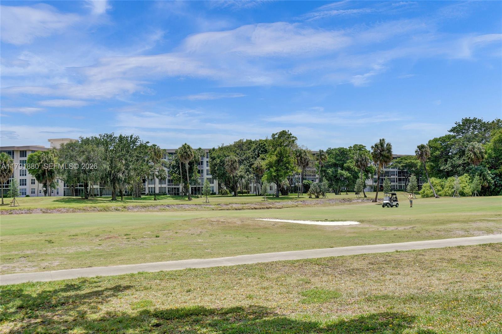 3520 Oaks Way, Unit 308 Pompano Beach, FL 33069 - Photo 30 of 40 a view of a tennis court