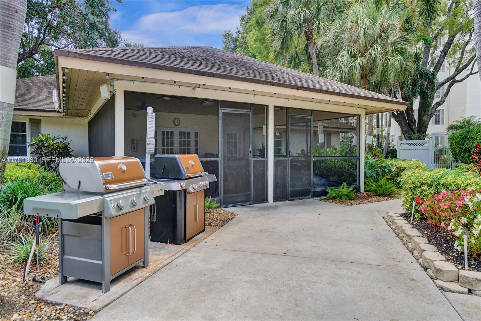 3520 Oaks Way, Unit 308 Pompano Beach, FL 33069 - Photo 36 of 40 a front view of house with outdoor seating