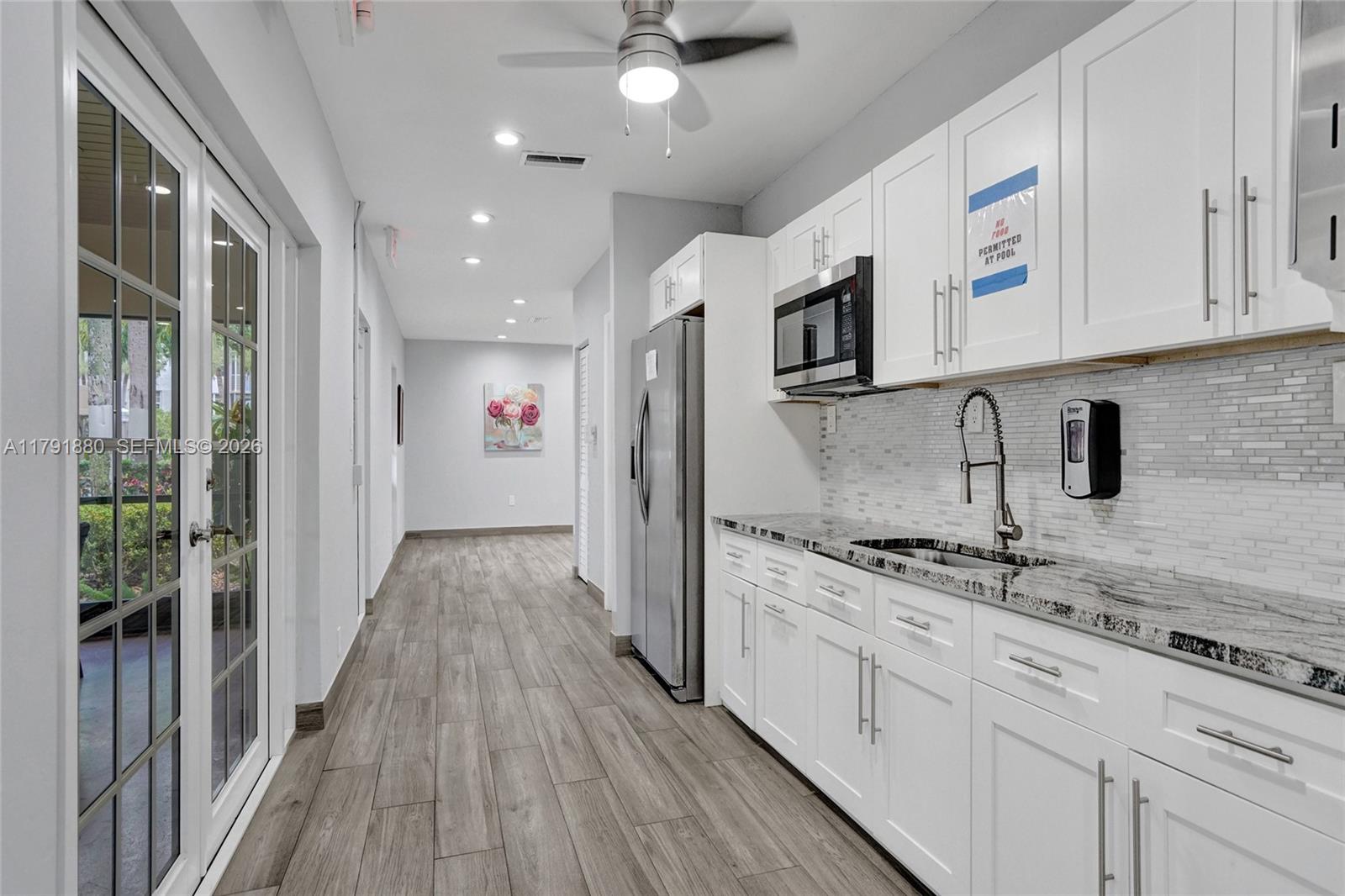 3520 Oaks Way, Unit 308 Pompano Beach, FL 33069 - Photo 38 of 40 a view of a kitchen with electric appliances