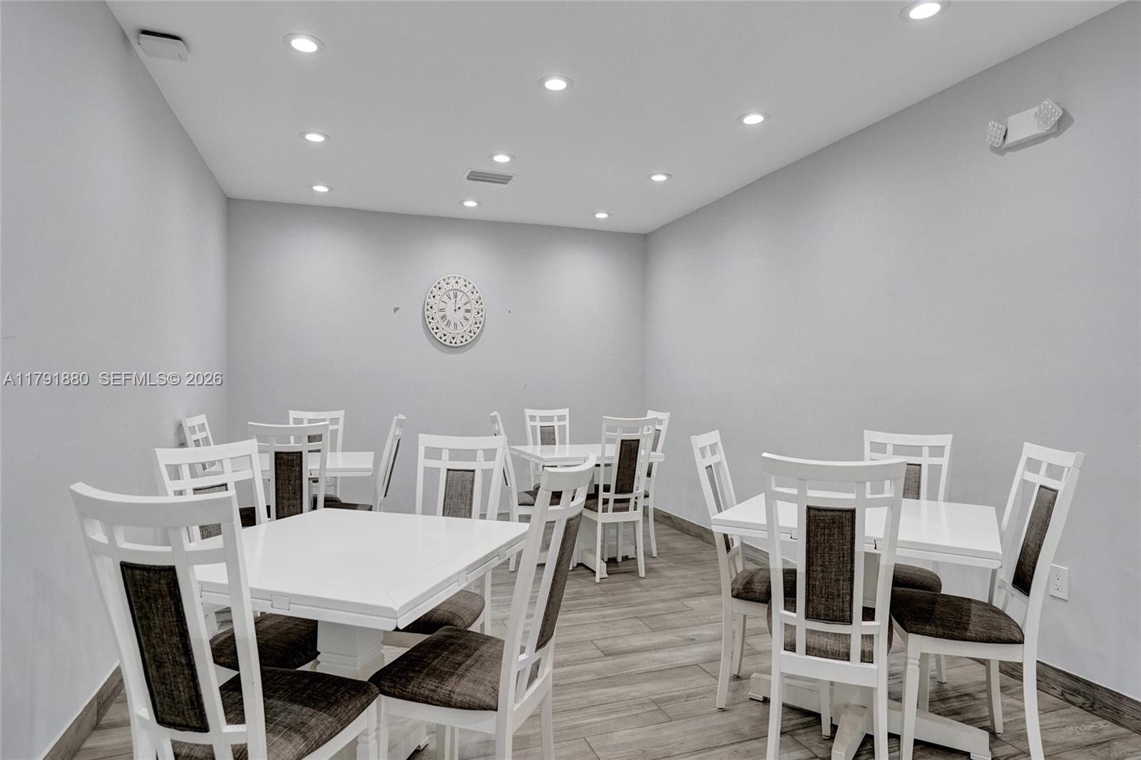 3520 Oaks Way, Unit 308 Pompano Beach, FL 33069 - Photo 40 of 40 a view of a dining room with furniture