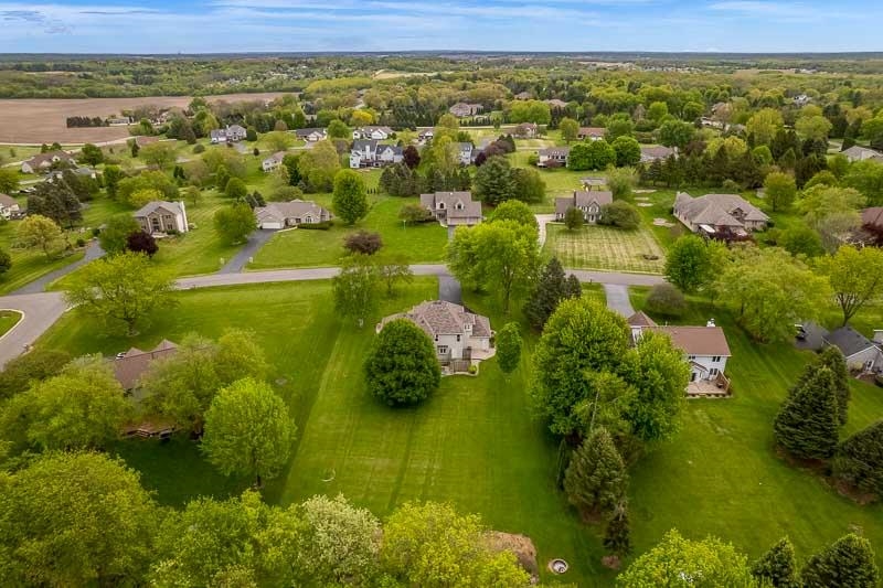 8833 West Ridge Drive Belvidere, IL 61008 - Photo 19 of 65 a view of a lake with a houses