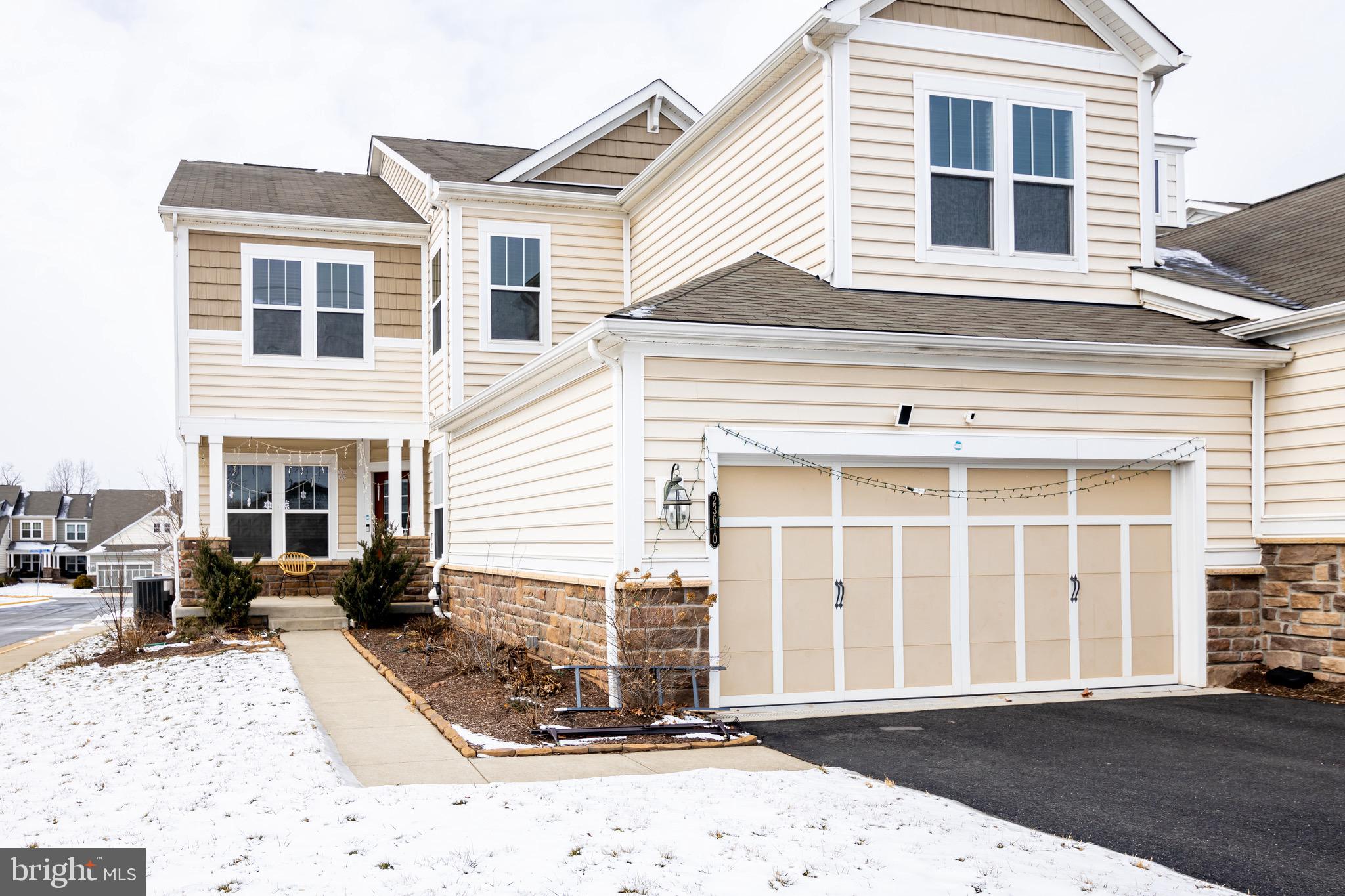 23610 Christina Ridge Square Ashburn, VA 20148 - Photo 1 of 30 a front view of a house with a yard