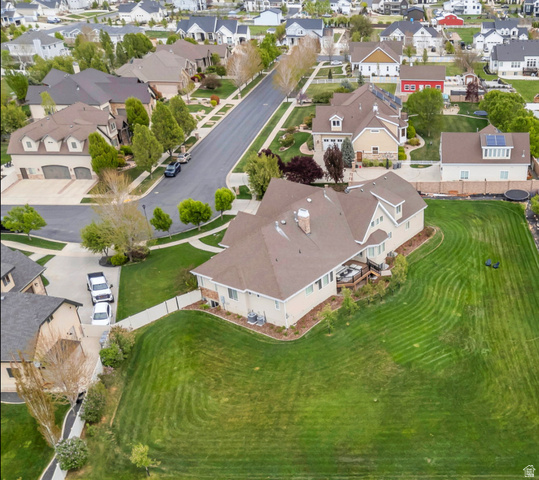 1355 West 1000 South Mapleton, UT 84664 - Photo 59 of 62 Expansive property featuring a large manicured lawn, a multi-level deck, mature landscaping, and a well-maintained brown shingle roof