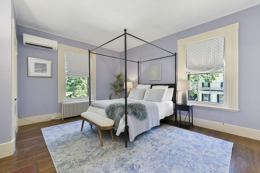 4 Berkeley Street Cambridge, MA 02138 - Photo 20 of 28 a bedroom with a bed lamps and window