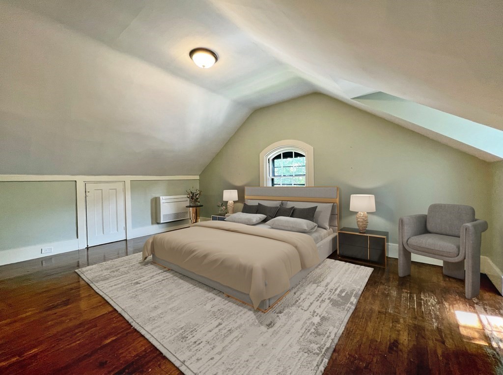 4 Berkeley Street Cambridge, MA 02138 - Photo 23 of 28 a bedroom with a large bed and a couch