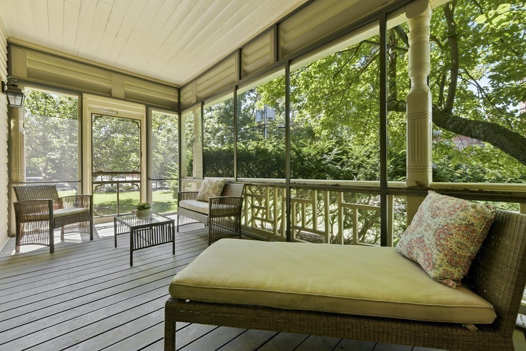 4 Berkeley Street Cambridge, MA 02138 - Photo 26 of 28 a balcony with furniture and wooden floor