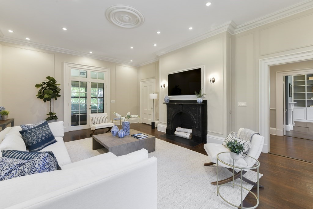 4 Berkeley Street Cambridge, MA 02138 - Photo 5 of 28 a living room with furniture flat screen tv and a fireplace