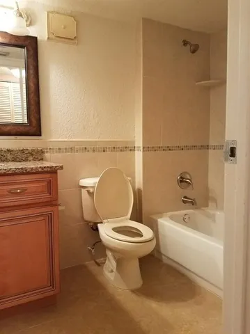 a bathroom with a double vanity sink and mirror