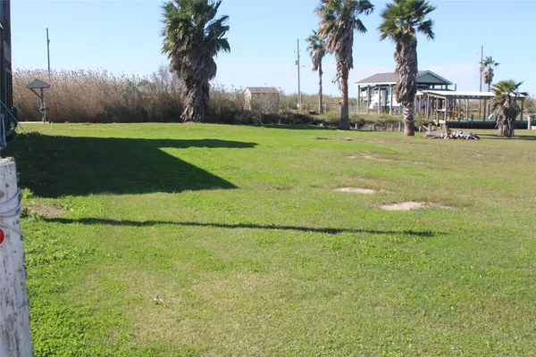 a view of a golf course with a house