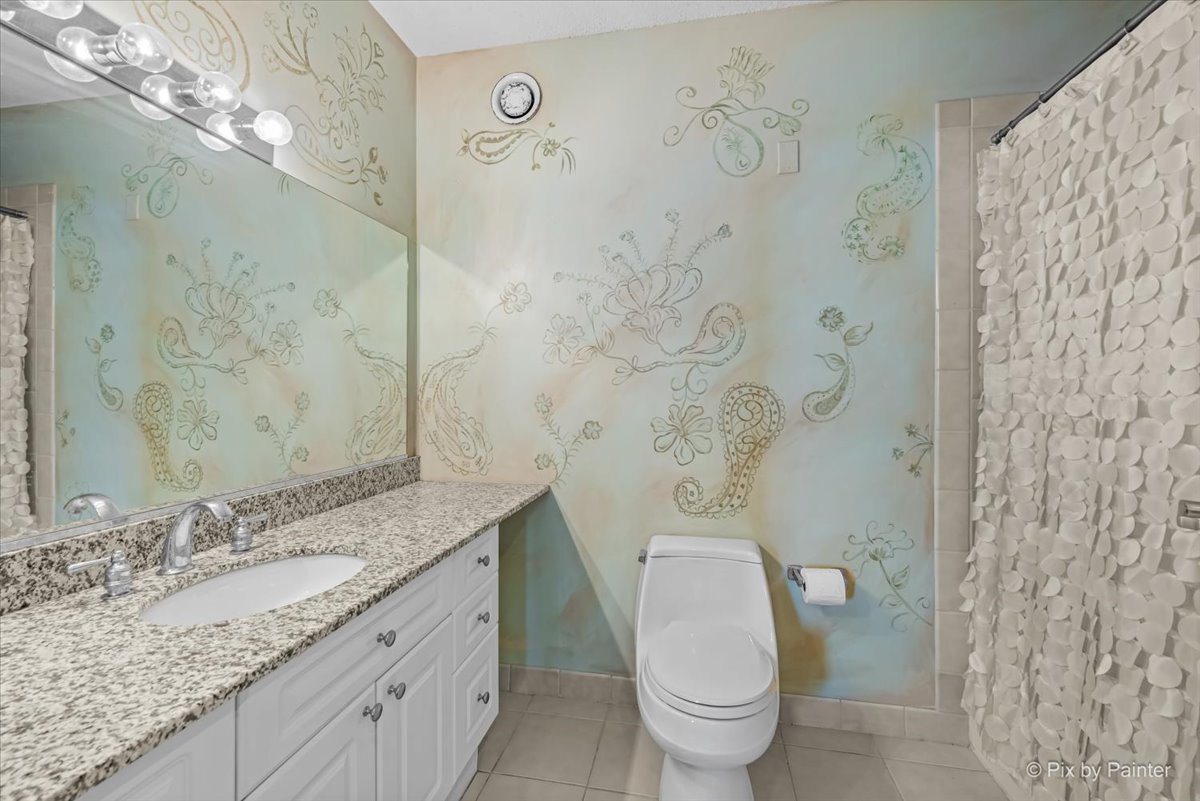 512 North McClurg Court, Unit 501 Chicago, IL 60611 - Photo 17 of 40 a bathroom with a granite countertop sink a toilet and a shower