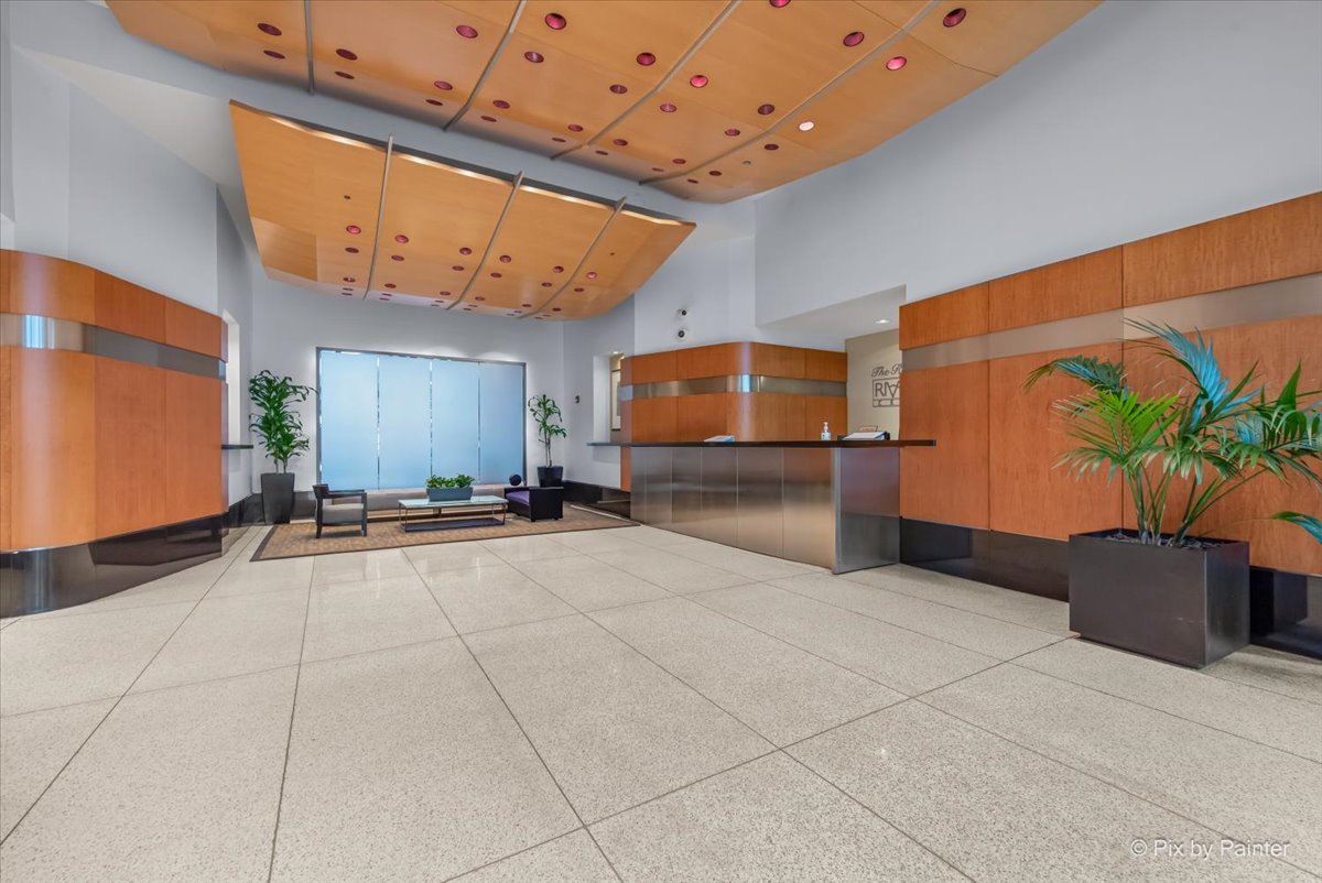 512 North McClurg Court, Unit 501 Chicago, IL 60611 - Photo 3 of 40 a view of an entryway with a table and chair in front of it