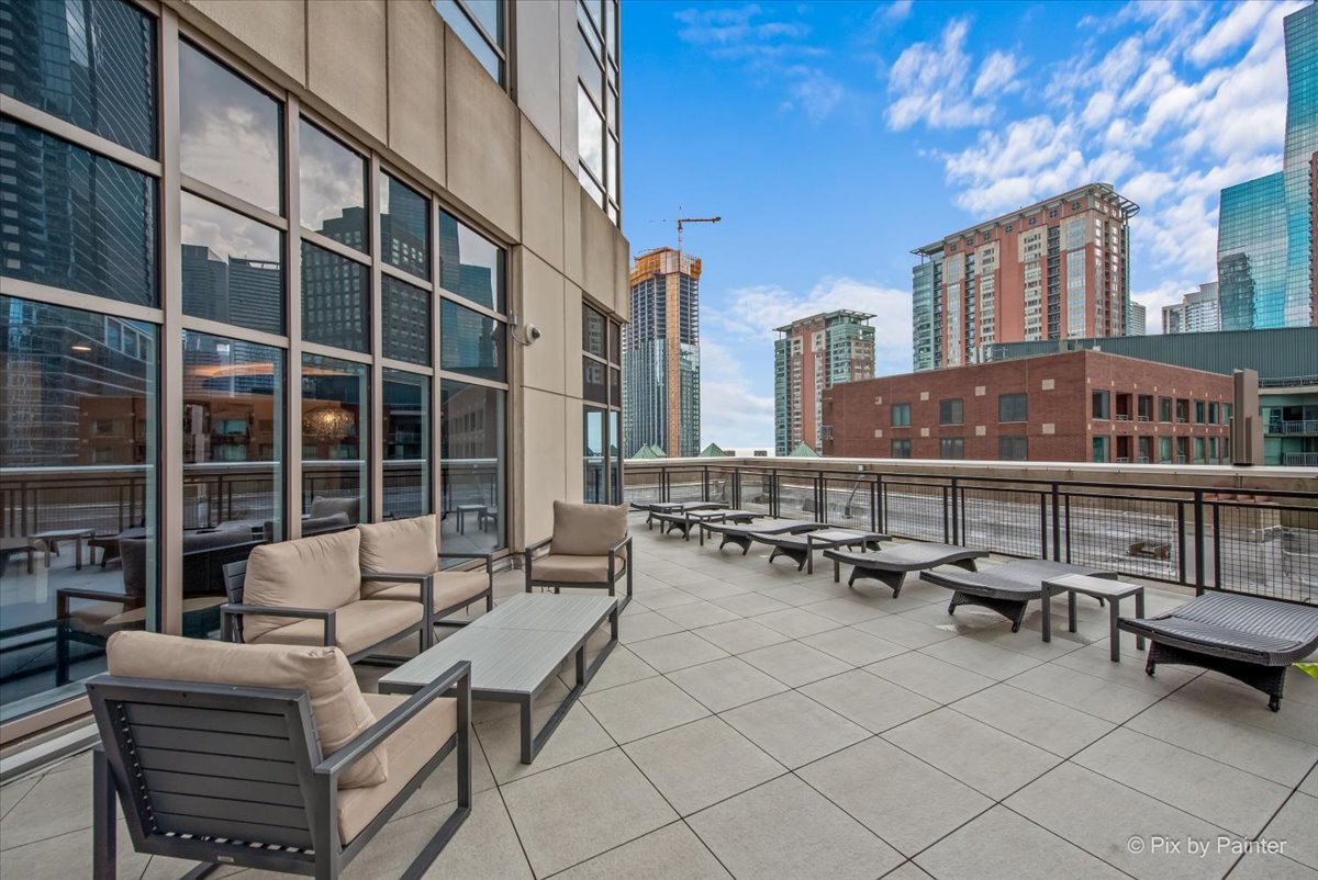 512 North McClurg Court, Unit 501 Chicago, IL 60611 - Photo 31 of 40 a view of balcony with chairs and a potted plant