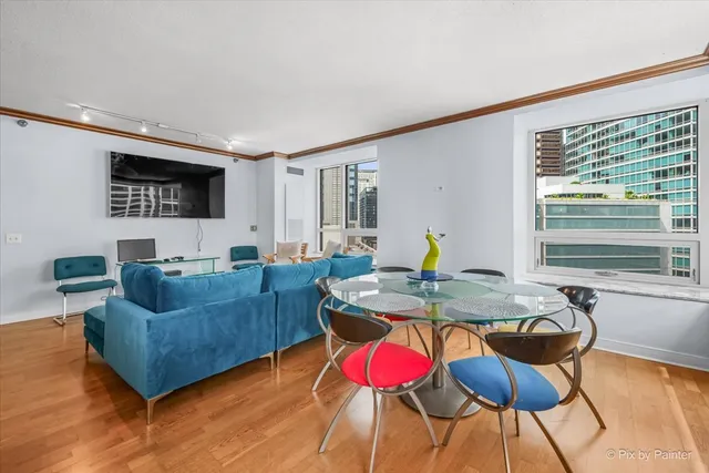 a living room with furniture and flat screen tv