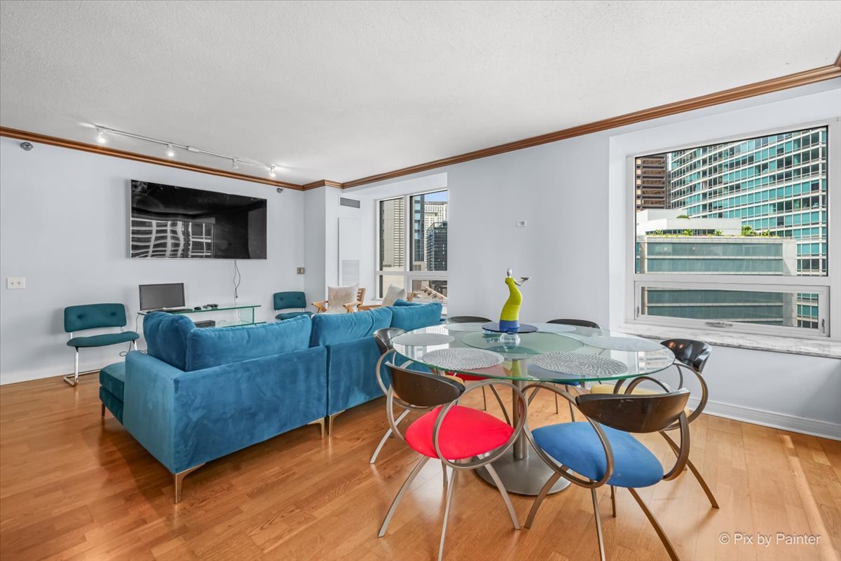 512 North McClurg Court, Unit 501 Chicago, IL 60611 - Photo 9 of 40 a living room with furniture and flat screen tv