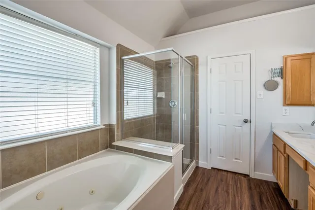 a bathroom with a tub and a sink