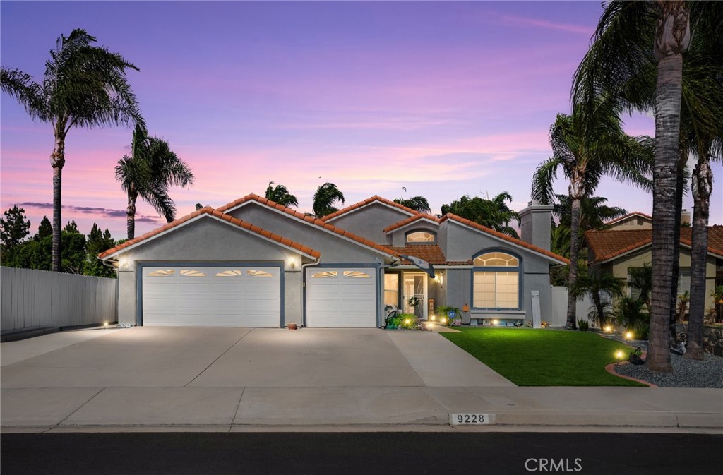 9228 Whiting Way Riverside, CA 92508 - Photo 1 of 1 a front view of a house with a yard and garage