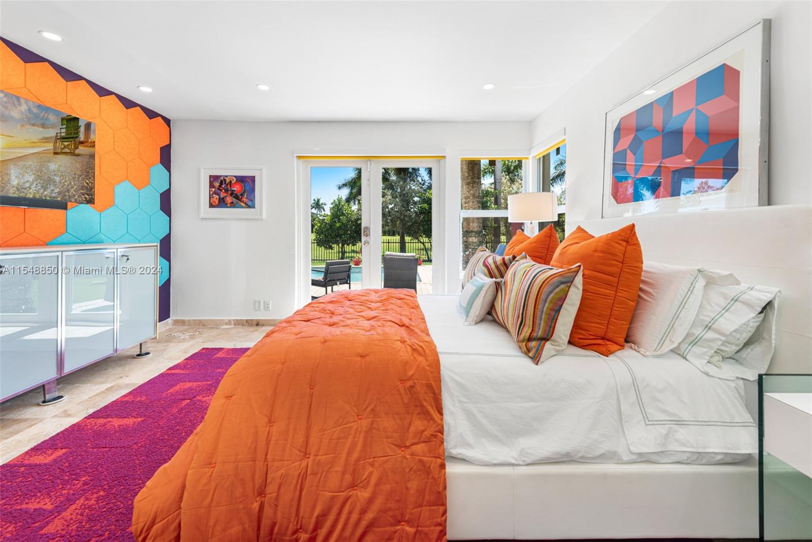 5301 Alton Road Miami Beach, FL 33140 - Photo 16 of 28 a bed sitting in a bedroom next to a window