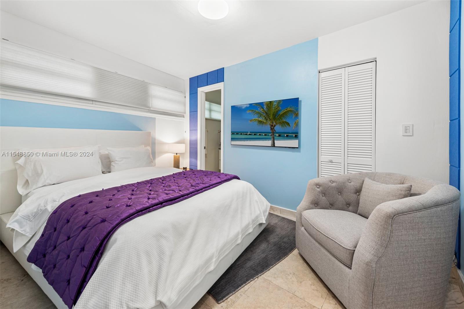 5301 Alton Road Miami Beach, FL 33140 - Photo 22 of 28 a bedroom with a bed and a couch