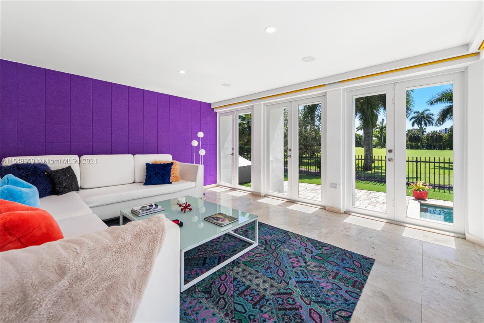 5301 Alton Road Miami Beach, FL 33140 - Photo 4 of 28 a living room with furniture and a large window