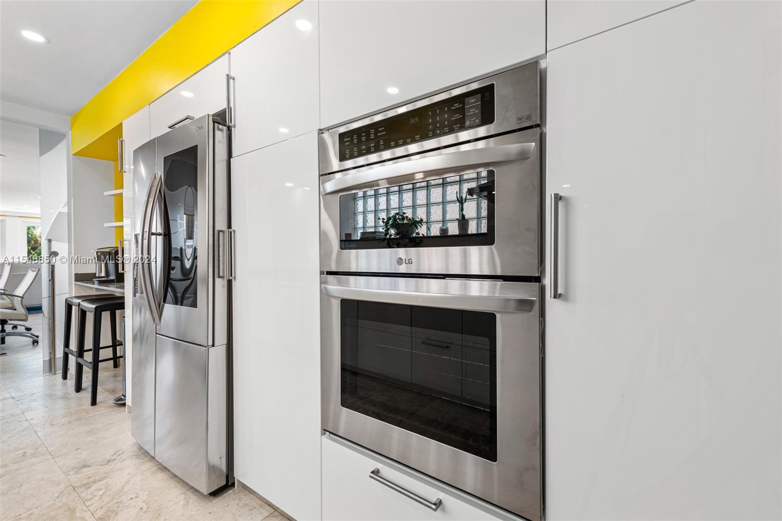 5301 Alton Road Miami Beach, FL 33140 - Photo 9 of 28 a kitchen with a stove and a microwave