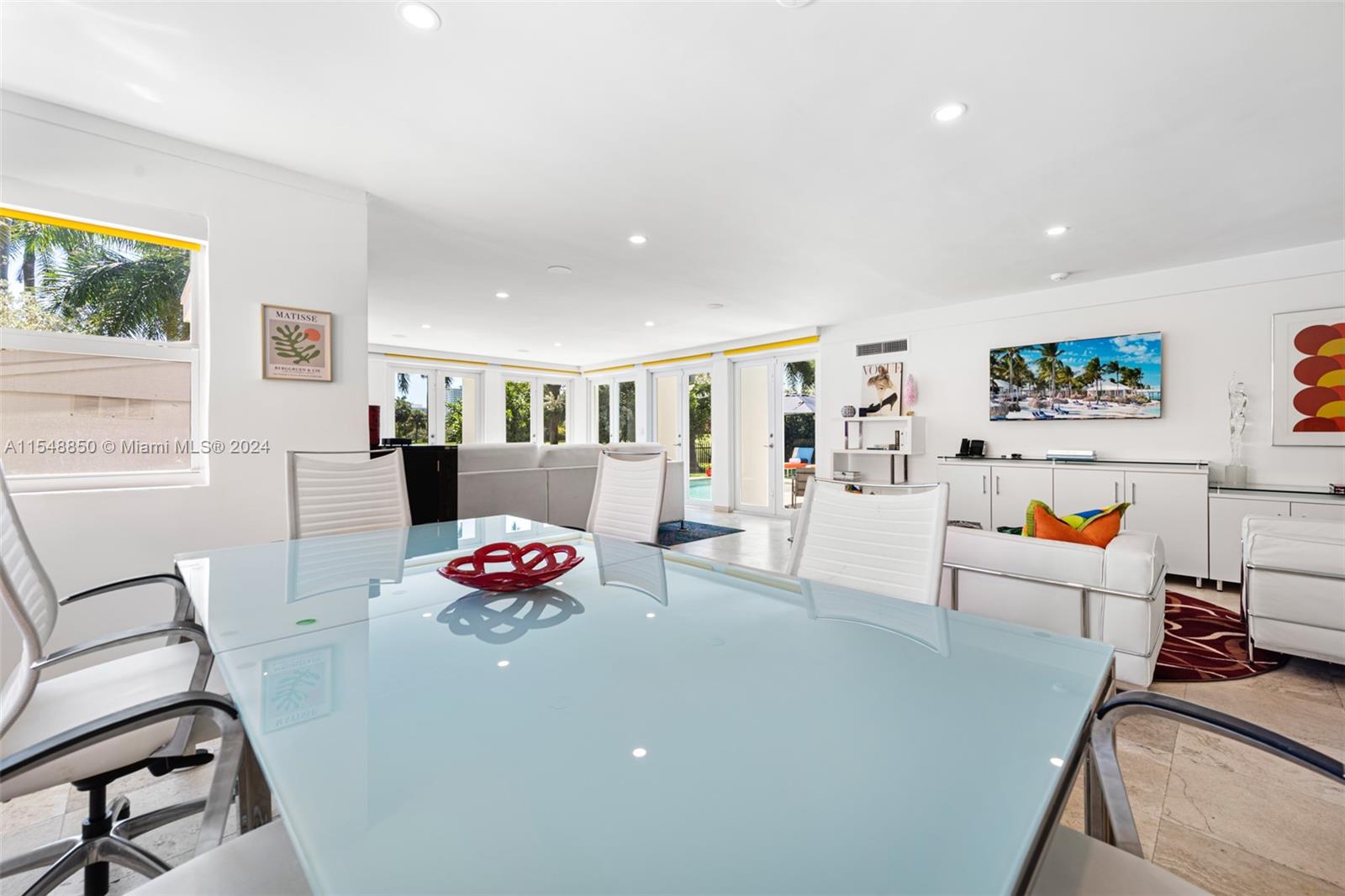 5301 Alton Road Miami Beach, FL 33140 - Photo 10 of 28 a living room with furniture and a flat screen tv