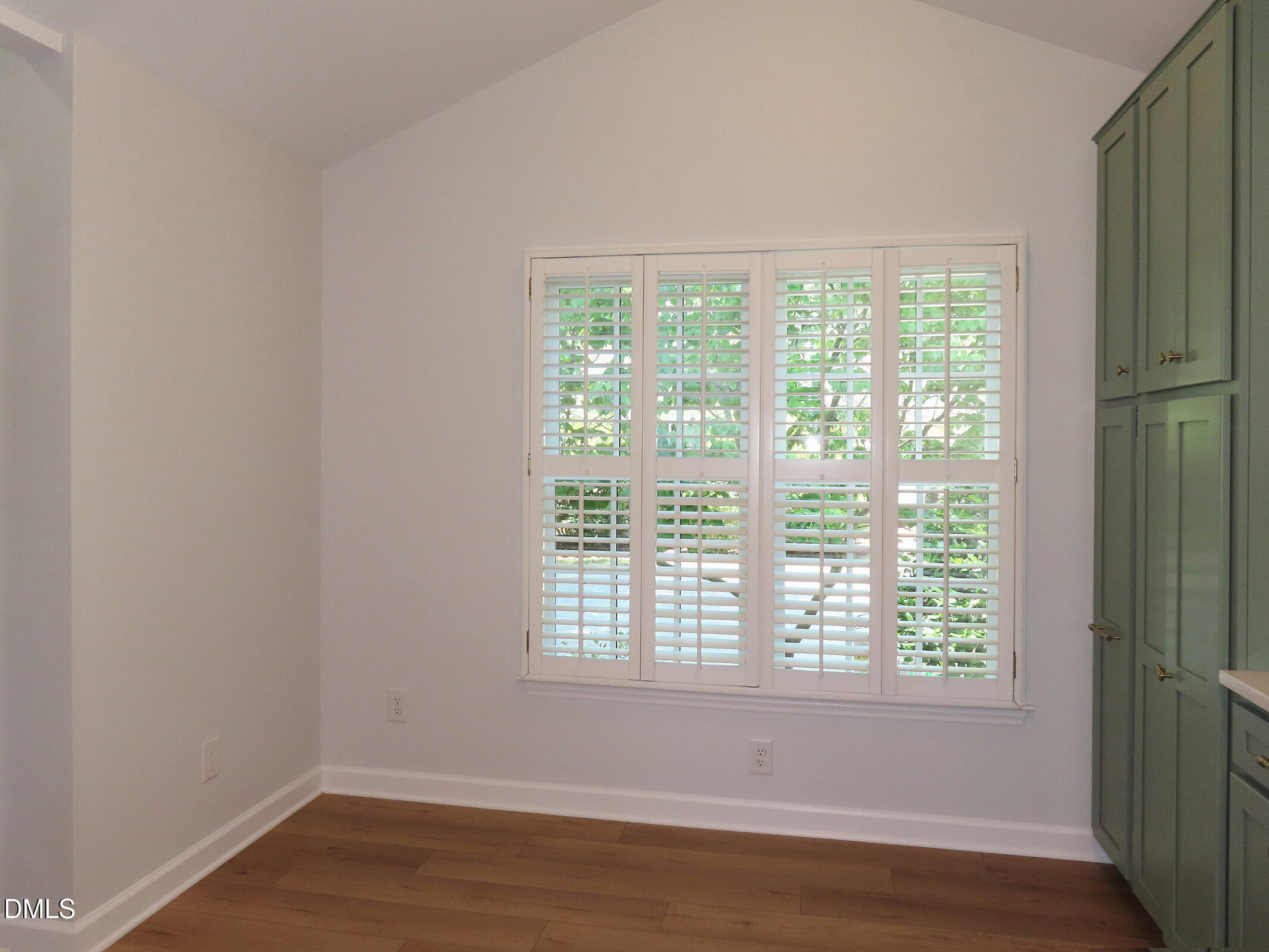 120 Weatherhill Point Carrboro, NC 27510 - Photo 7 of 25 a view of an empty room with wooden floor and a window