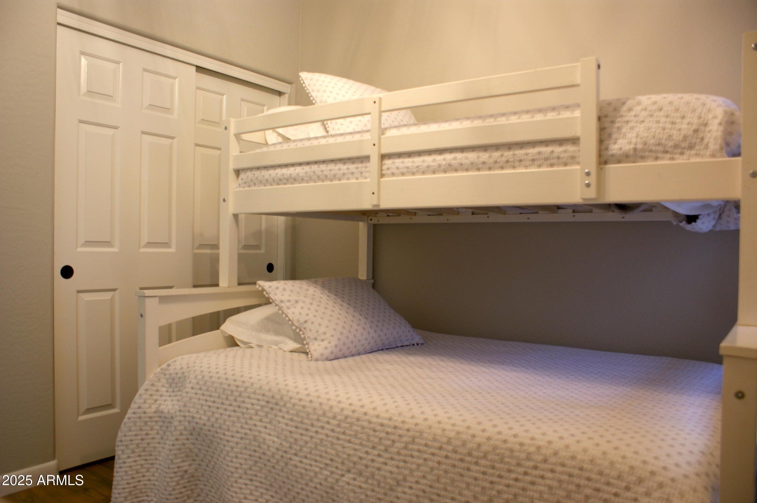 525 North Miller Road, Unit 145 Scottsdale, AZ 85257 - Photo 5 of 9 a bedroom with a bed and a window