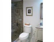 2311 South Cypress Bend Drive, Unit 416 Pompano Beach, FL 33069 - Photo 12 of 16 a white toilet sitting next to a bathroom sink