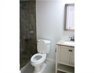 2311 South Cypress Bend Drive, Unit 416 Pompano Beach, FL 33069 - Photo 15 of 16 a bathroom with a toilet sink and mirror