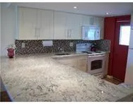 a kitchen with a stove and cabinets