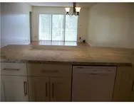 a kitchen with a stove and cabinets